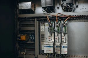 Electrician inspecting a circuit breaker panel in a San Francisco home